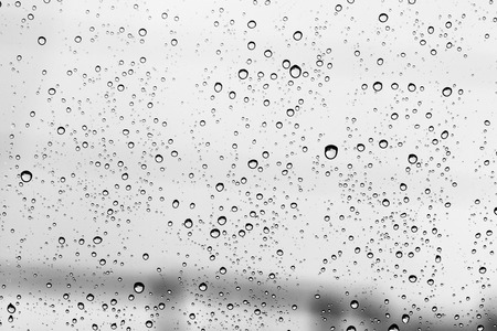 Water drop grey on glass mirror background.の写真素材