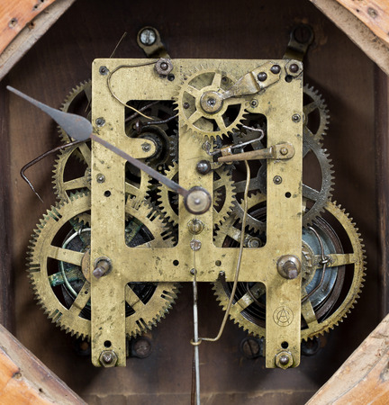 Vintage rusty antique cog clock.の写真素材