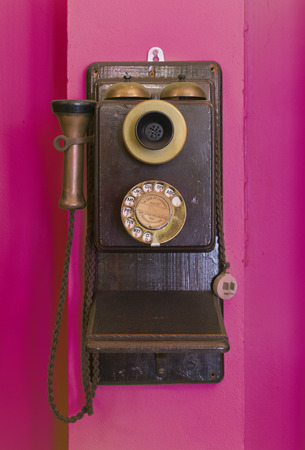 Antique vintage telephone purple grunge background.の写真素材