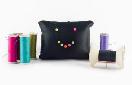 Thread color set with pillow black smile on white background.