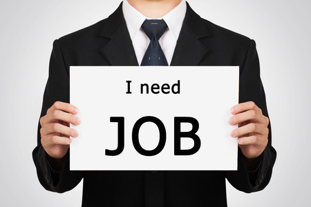 Businessman holding  whiteboard with text.の写真素材