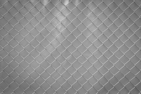 Steel mesh rusty on grey background.の写真素材