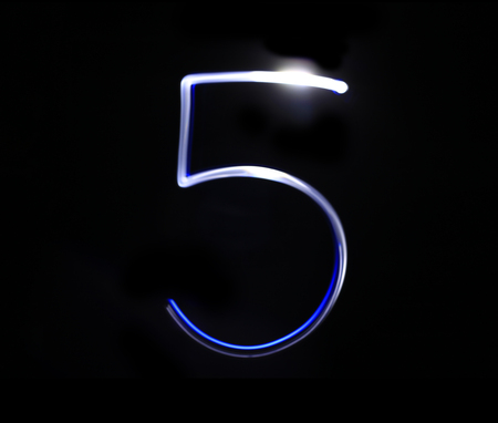 Five blue light digit hand writing over black background.