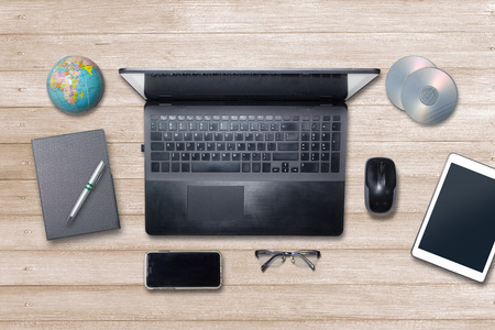 Office desk wooden light brown table on top view.の写真素材