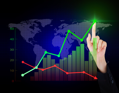 Business hand working economy of financial in the world.の写真素材