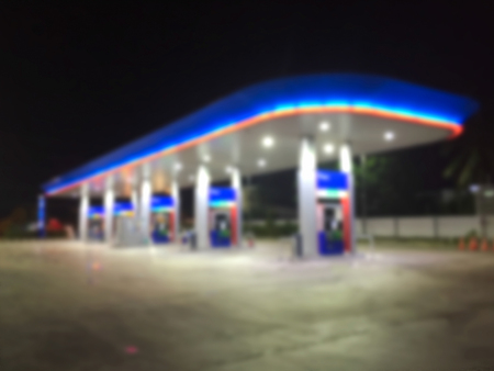 Night gas station on  blurry background.
