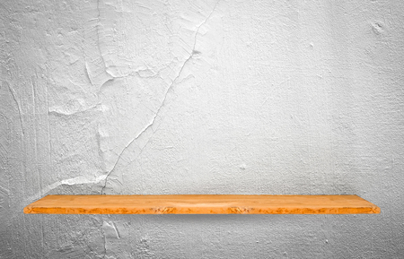 Wooden shelf on concrete wall background.の写真素材