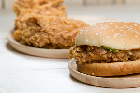 Sandwich with chicken burger on wooden plate.の写真素材