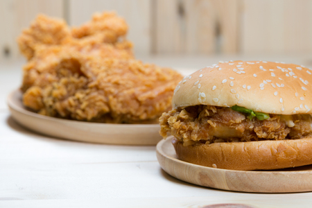 Sandwich with chicken burger on wooden plate.の写真素材