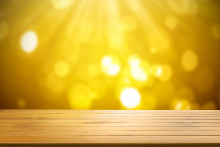 Wood shelf table on gold light bokeh background.の写真素材