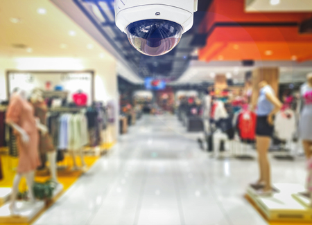 CCTV Security camera shopping department store on background.の写真素材