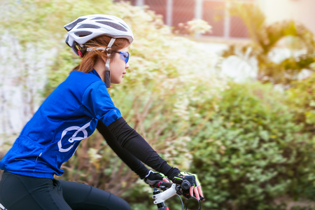 Asian woman cycling in the park. healthy conceptの写真素材