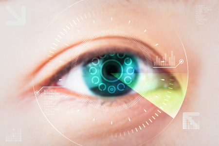 Closeup of woman eye technology with visual effects. Eye cataract conceptの写真素材