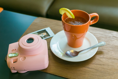 NAKHONRATCHASIMA, THAILAND - FEB 09, 2016 :Teapot and teacup in vintage style with pink camera.のeditorial素材