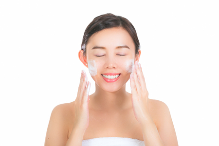 Close up of beautiful young woman with cleansing foam for skin care. with clipping pathの写真素材