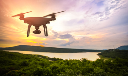 Drone in the sky at colorful sunset on Lake Hill.