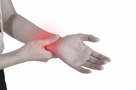 Holding hand to spot of wrist pain.の写真素材