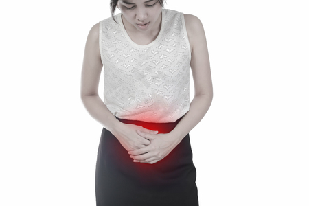 Sick woman having a stomach ache. Concept healthの写真素材