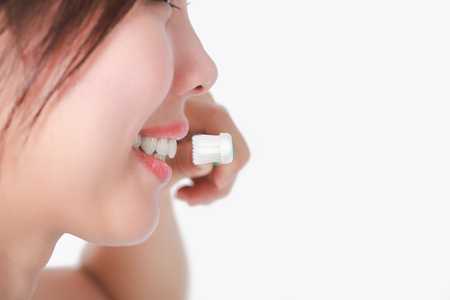 Female teeth brush isolated white background. Healthy concepts.の写真素材