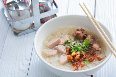 Vietnamese noodle soup on white wooden table.の写真素材