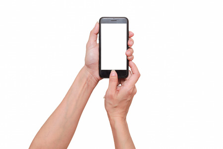 Closeup shot of a woman typing on mobile phone isolated on white background.の写真素材