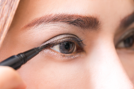 Close-up women make-up with black and brown eyeliner.の写真素材