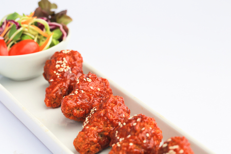 Bonchon Chicken spicy and sweet taste on white table.の写真素材