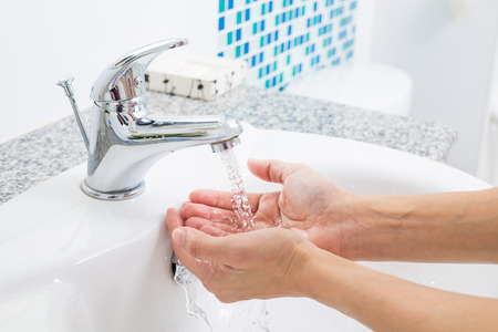 Hygiene. Cleaning Hands with water. Washing hands on sink.の写真素材