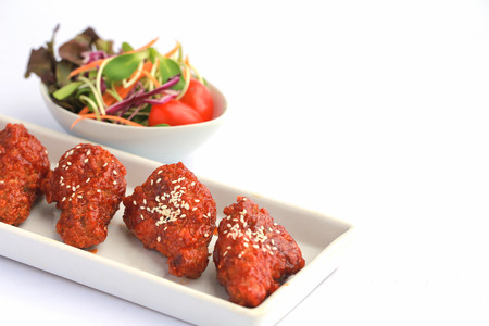 Bonchon Chicken spicy and sweet taste on white table.の写真素材