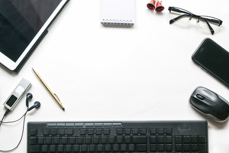 White office desk table with modern technology work place. Top view with copy space.の写真素材