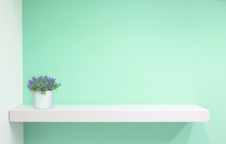 Retail shelf on green vintage background. fill objects.の写真素材