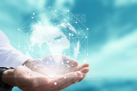 Businessman holding in hand with global connection concept.の写真素材