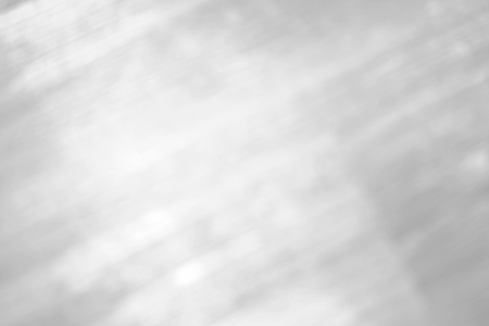 Abstract bright shiny white-grey blurred background.の写真素材