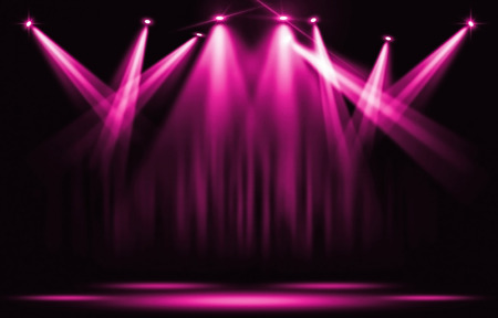 Stage lights. Pink violet spotlight with certain through the darkness.の写真素材