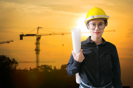 Engineers woman at construction site on background.の写真素材