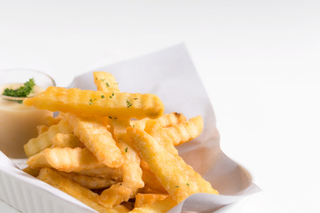 French fries in a bowl on a plate background.の写真素材