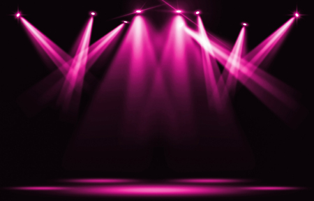 Stage lights. Pink violet spotlight strike through the darkness.の写真素材