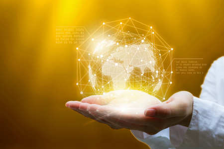 Businessman holding in hand with global connection concept.の写真素材