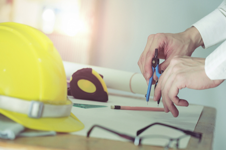 Hands of Engineer working on blueprint, Image of engineering.の写真素材
