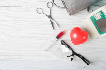 Various medical equipment on white wooden background. on topの写真素材