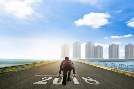 Business man ready to run toward the 2018 new year. Business  conceptの写真素材