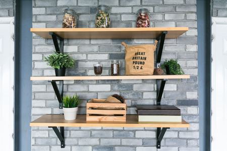 Wooden shelves with different home related objects.の写真素材