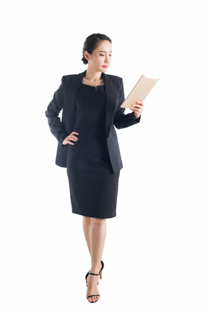 Business woman holding tablet computer isolated on white background.の写真素材