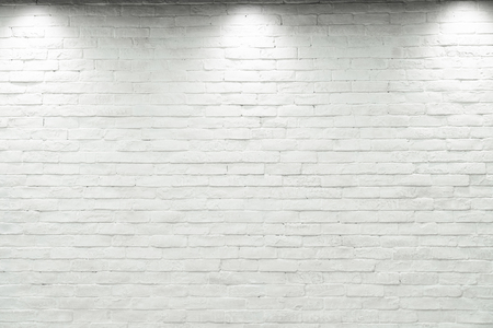 Empty white wall with halogen with 3 lamps.の写真素材