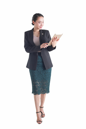 Business woman holding tablet computer isolated on white background.の写真素材