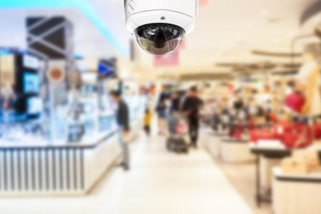 CCTV Security camera shopping department store on blurry background.の写真素材