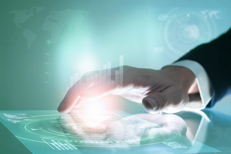 Businessman hand pushing on screen interface.の写真素材