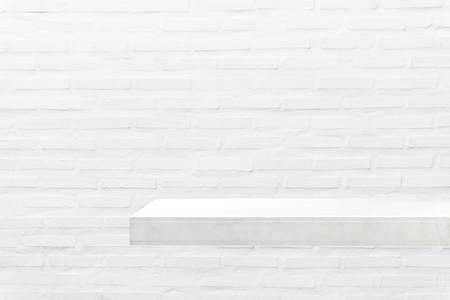 White empty shelf on white concrete wall.の写真素材