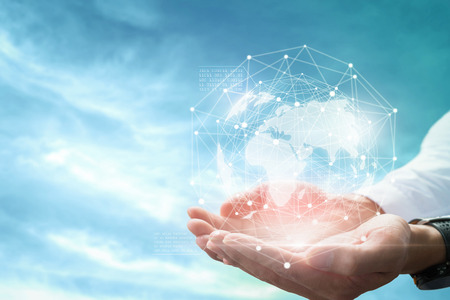 Businessman holding in hands with global connection concept.の写真素材