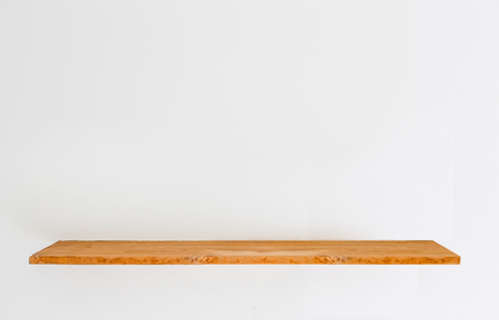 Wooden shelf on concrete white wall.の写真素材